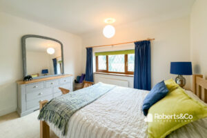 Hutton estate agents present you with a colourfully designed bedroom area for two